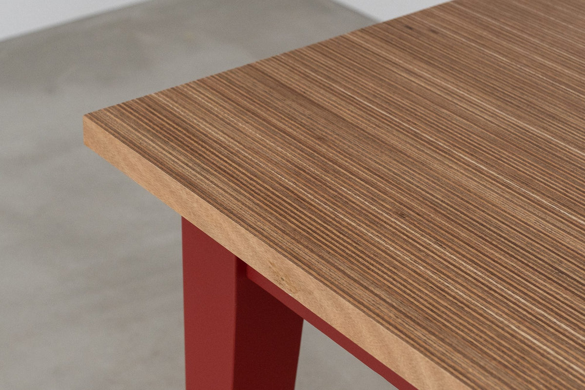 The Grainline dining table with a Meranti Edge Grain Ply top on Baked Cherry painted legs